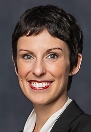 Short haired Caucasian female with bright smile
